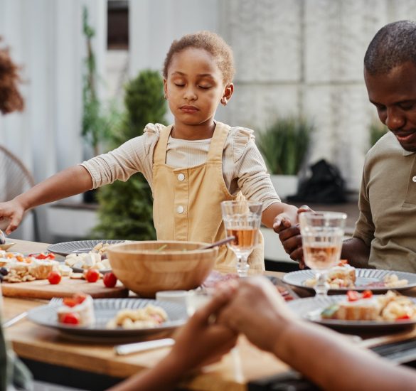 Family Praying at Dinner