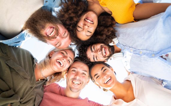 Multicultural group of friends in circle
